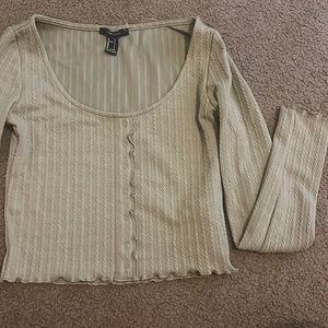 Green cropped top with lettuce edge sleeves and buttons